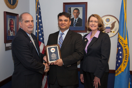 Left to right: Chairperson Poleo, recipient Albert Munoz, and USDA Commission member Lisa Wilusz