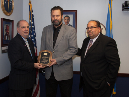 Left to right:  Chairperson Poleo, recipient Michael A. Cowley, and Ruben Filomeno, Director, EEO Office, DLA Troop Support