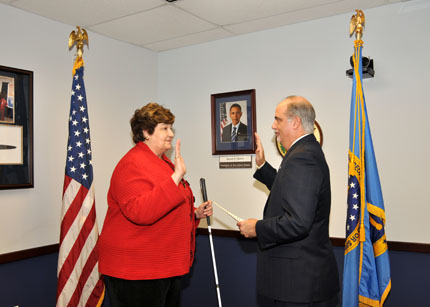 Karen McCulloh, a private citizen, is sworn-in by Chairperson Tony Poleo, as a member of the Committee for Purchase From People Who Are Blind or Severely Disabled