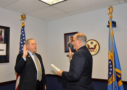 Jan Frye, from the Department of Veterans Affairs, is sworn-in by Chairperson Tony Poleo, as a member of the Committee for Purchase From People Who Are Blind or Severely Disabled