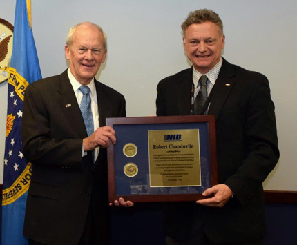 Chairperson J. Anthony Poleo (right) and Vice Chairperson James A. Kesteloot (left) with recipient Michael Gilliam (center).