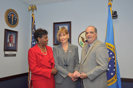 Left to right:  U.S. AbilityOne Commission Executive Director Tina Ballard, Honoree Dr. Carol E. Lowman, and U.S. AbilityOne Commission Chairperson J. Anthony Poleo.