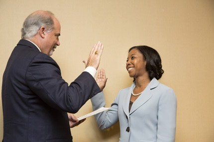 Chairperson J. Anthony Poleo swears in Commission member Virna L. Winters, Department of Commerce.