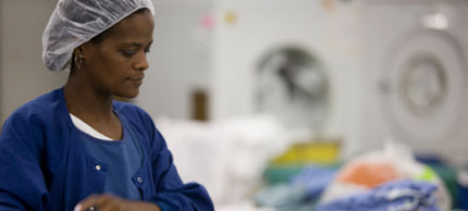 Photo of woman working in laundry.