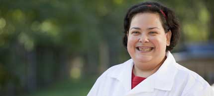 Photo of woman in lab coat.